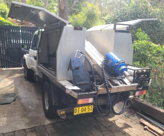 Rear tray of the Landcruiser showing the auger and DCP drilling equipment and water tank