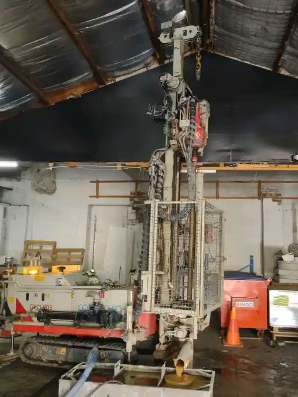 Comacchio GEO205 drilling rig set up for drilling inside a shed