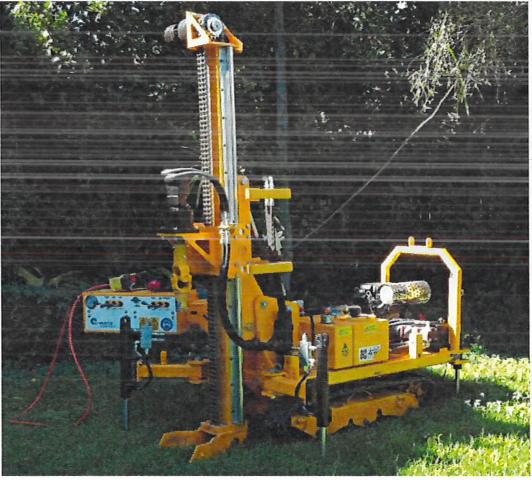 Bumble Bee tracked mini rig set up for auger and DCP work on grass